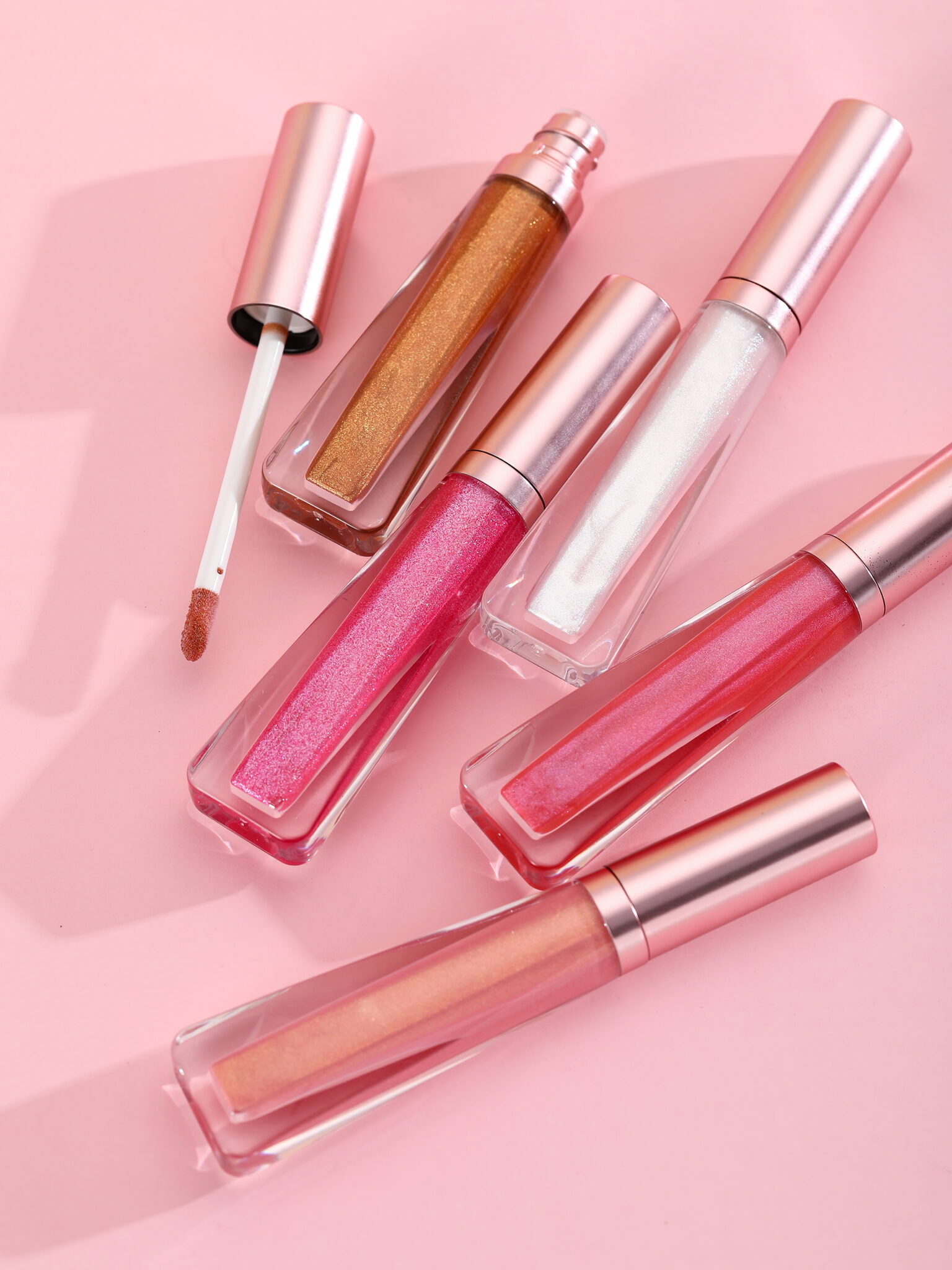 Wholesale sparkly & shimmer lip gloss no label with Rose gold packaging