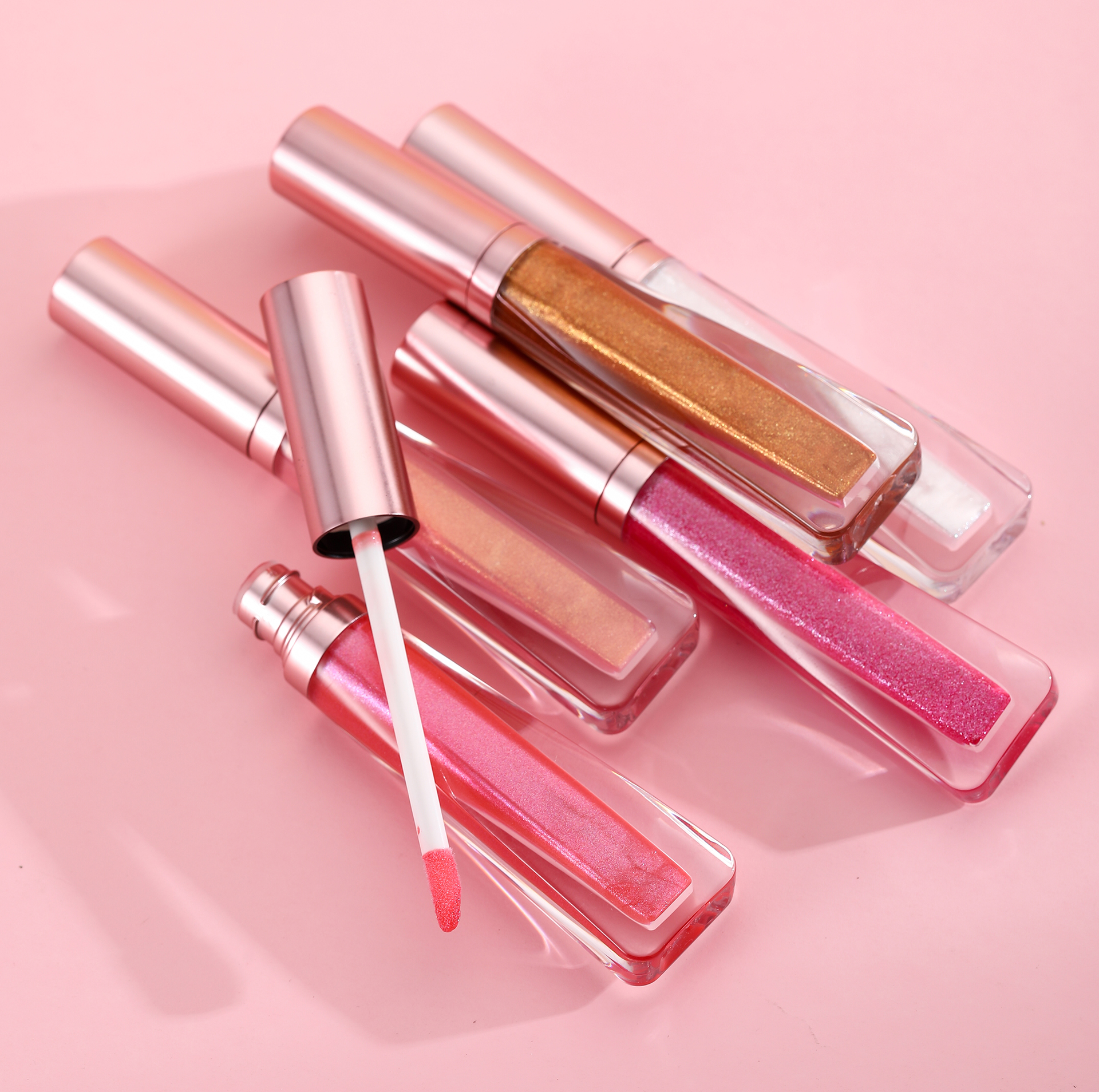 Wholesale sparkly & shimmer lip gloss no label with Rose gold packaging